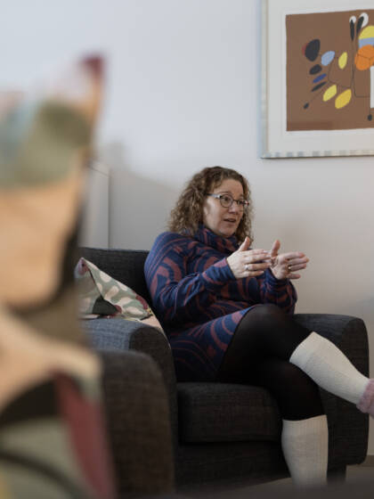 A person sitting in an armchair.