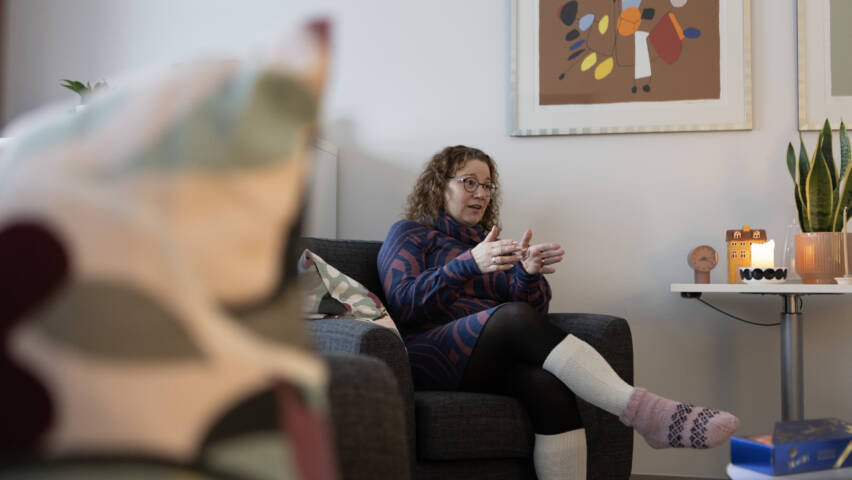 A person sitting in an armchair.
